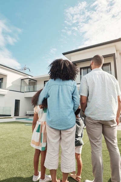 Love, new house and family in their backyard together looking at their property or luxury real esta.